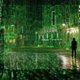 A still from the first Matrix Resurrections trailer is filled with green code overlaying Neo walking an empty street with a hotel sign lit up in red.